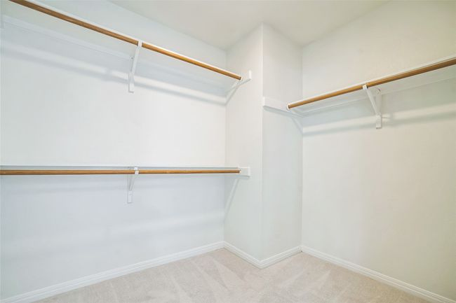 Spacious closet with carpet flooring | Image 25