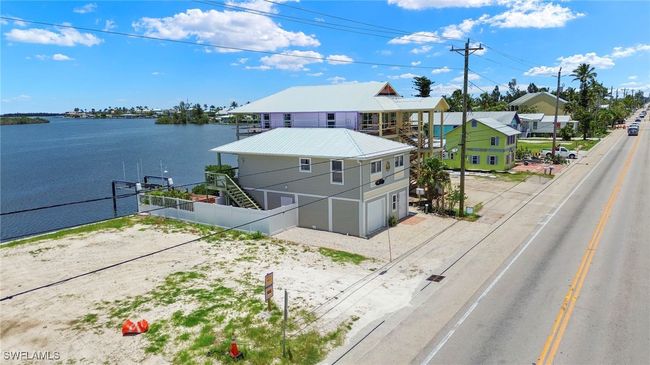 Aerial view of property and surrounding area with a large body of water | Image 23