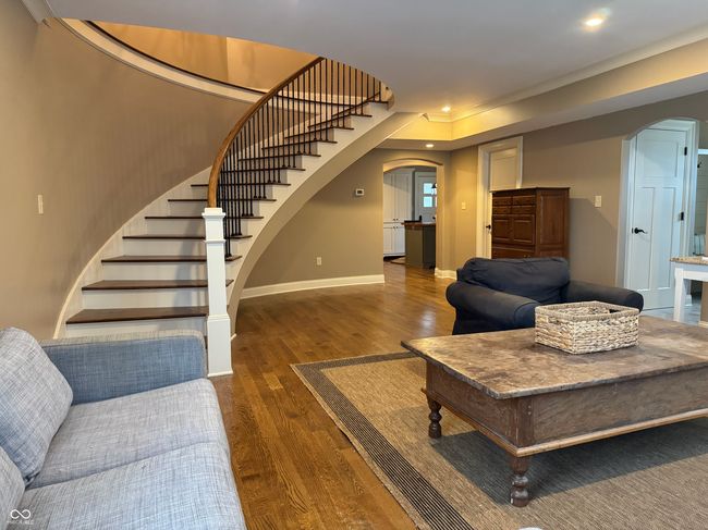 GREATROOM FEATURING CURVED STAIRCASE | Image 4