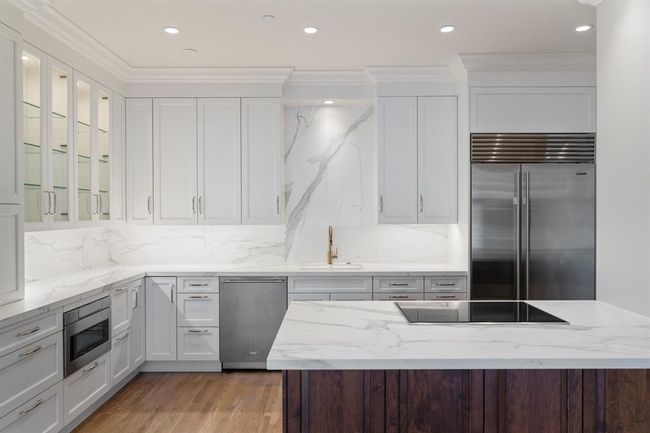 Classic finishes and design in this renovated kitchen. | Image 10