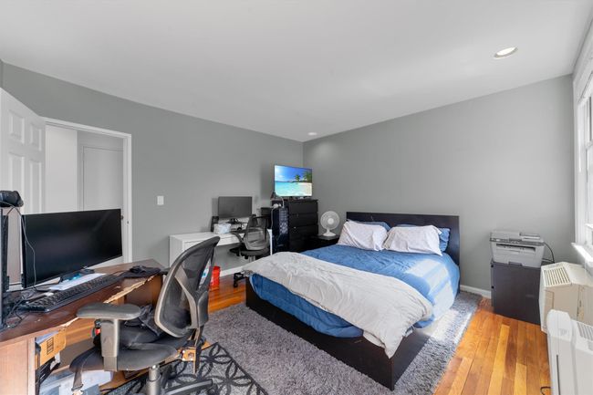 Bedroom with baseboards, light wood-style floors, and recessed lighting | Image 18