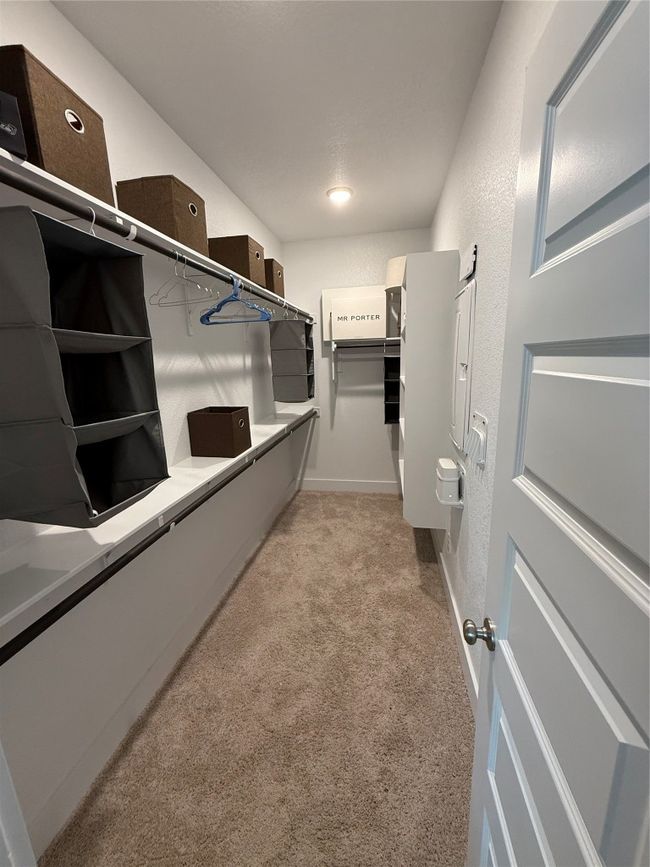 Spacious closet featuring light carpet | Image 20