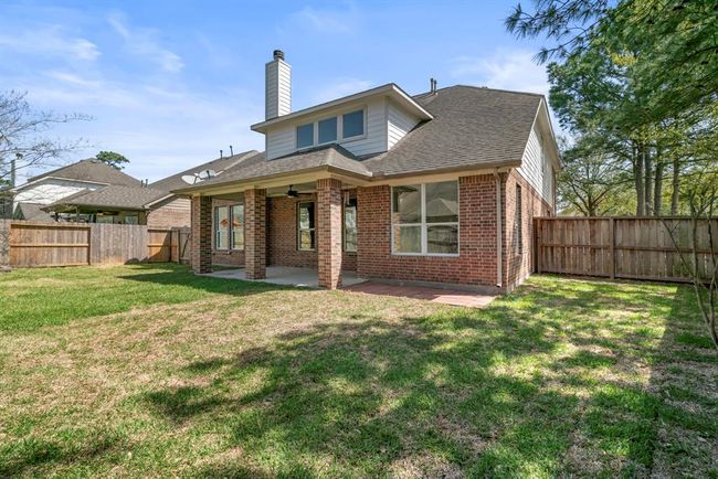 Enjoy the extra space and privacy of this expansive corner lot backyard, perfect for outdoor living and entertaining. The beautifully landscaped yard features a spacious covered patio—ideal for relaxing in the shade, hosting BBQs, or enjoying morning coffee. With plenty of room for a playset, garden, or future pool, this outdoor oasis offers endless possibilities. | Image 41