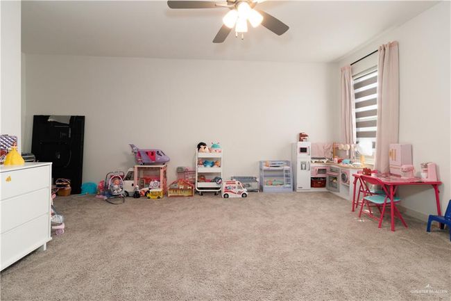 Recreation room featuring carpet and ceiling fan | Image 11