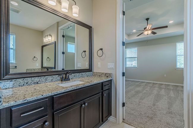 Bathroom featuring recessed lighting, plenty of natural light, vanity, and ceiling fan | Image 26
