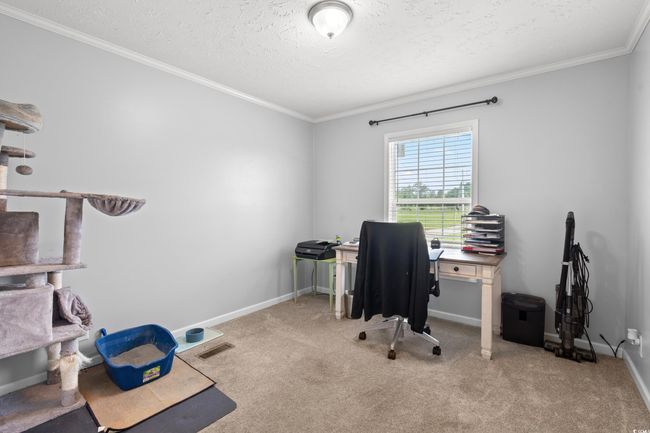 Office area featuring ornamental molding, carpet floors, and a textured ceiling | Image 21