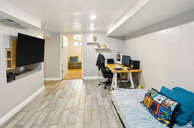 Office area with light wood-style flooring and baseboards | Image 14