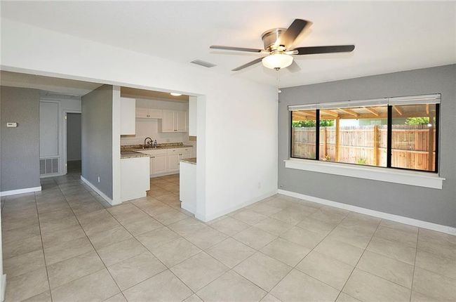 View from Front Entry/ Shows Dining and Kitchen Area | Image 8