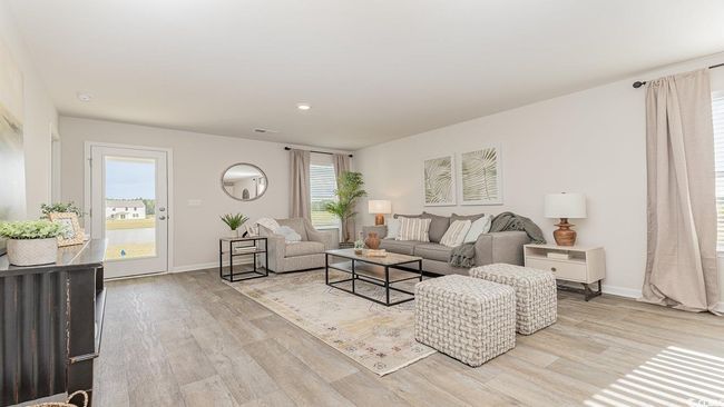 Living room with light hardwood / wood-style flooring | Image 10