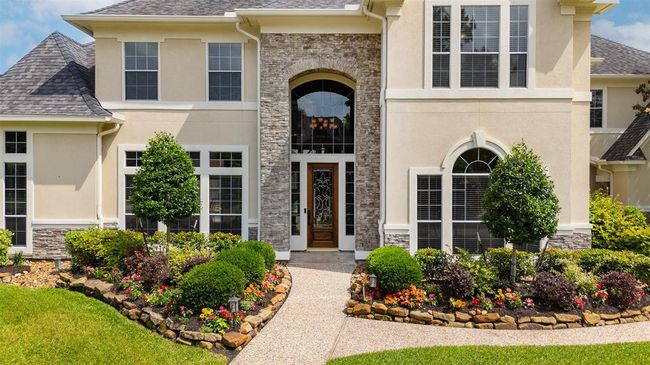 As you approach the front door, the scale and detail of the entrance set the tone. Step inside and take a closer look — where classic design and timeless elegance welcome you home. | Image 10