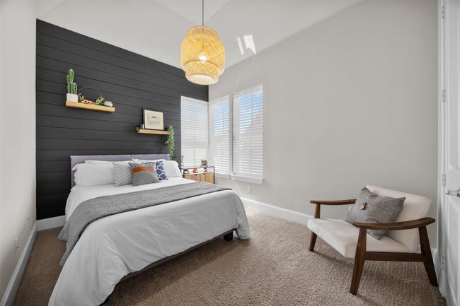Bedroom featuring carpet floors and wooden walls | Image 27