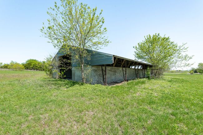 View of pole building with a lawn | Image 26