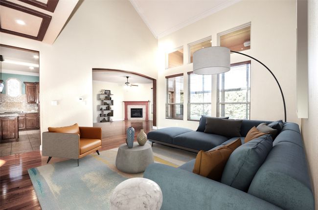 Virtual - Living area featuring ornamental molding, ceiling fan, a fireplace, light wood-type flooring, and high vaulted ceiling | Image 27