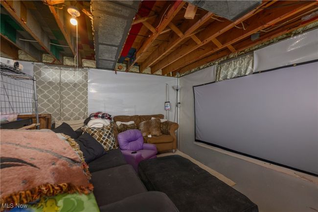 Home theater room featuring concrete floors | Image 18