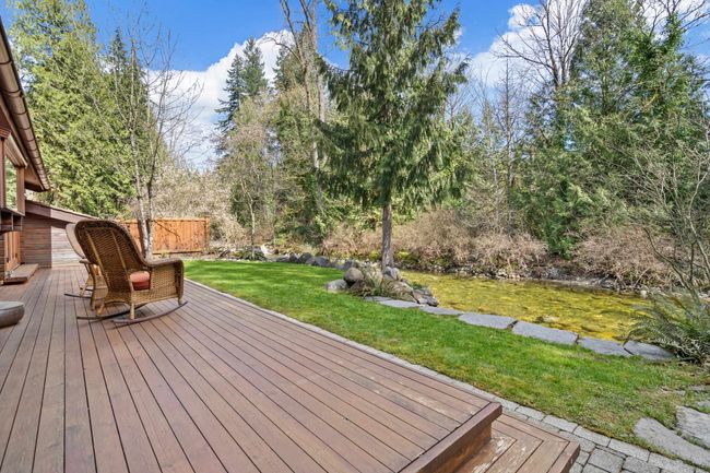 Wooden terrace featuring a lawn | Image 24