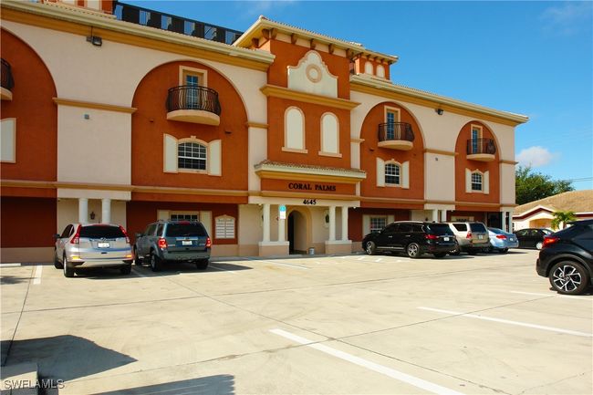 View of building exterior with uncovered parking | Image 16