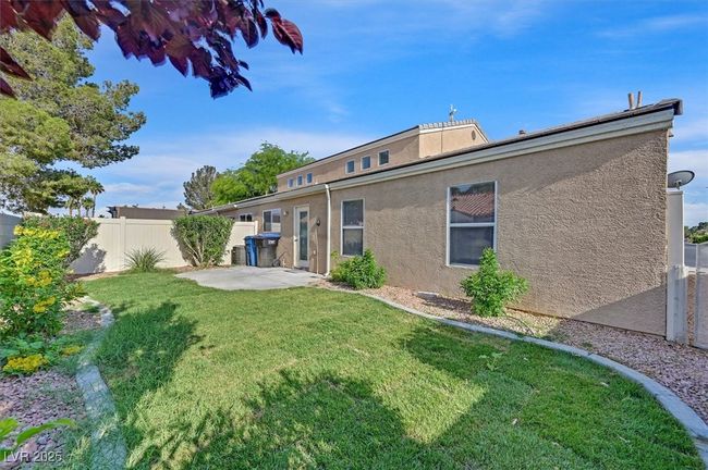 Rear view of property with stucco siding and a patio area | Image 21