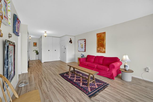 Living room with wood finished floors and baseboards | Image 10