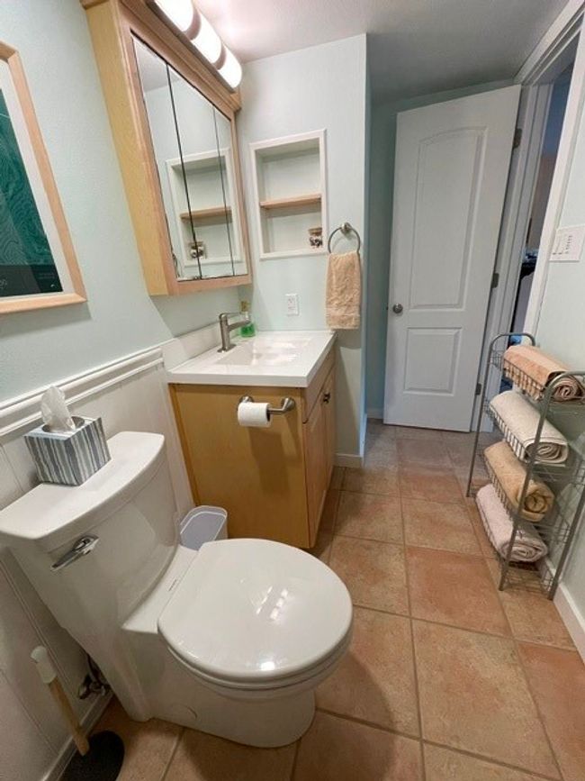 Bathroom with tile patterned floors, toilet, and vanity | Image 13