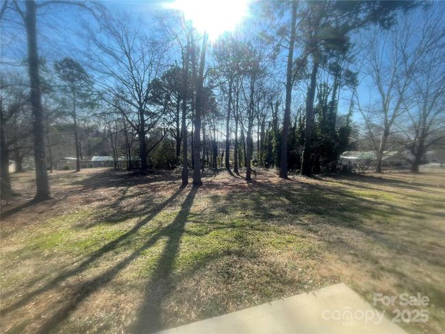 Flat back yard - lot is over half an acre, lots of room for gardening. | Image 19