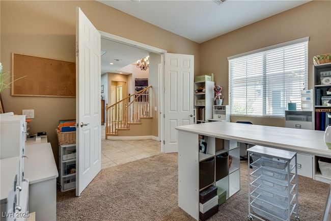 Office featuring light colored carpet, baseboards, and an inviting chandelier | Image 16