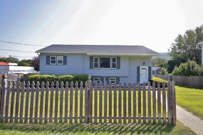 View of front of property featuring a front yard | Image 1