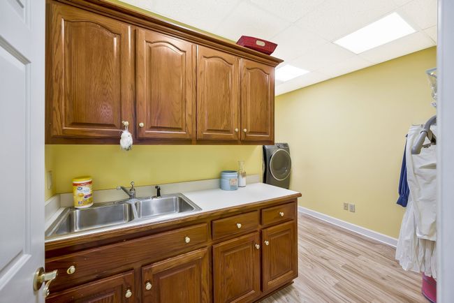 Laudry room located downstairs | Image 38