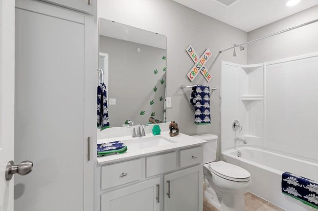 (Photo of a decorated model, actual homes finishes will vary) The upper level secondary bath is sure to provide plenty of space for everyone to get ready in the morning. | Image 15