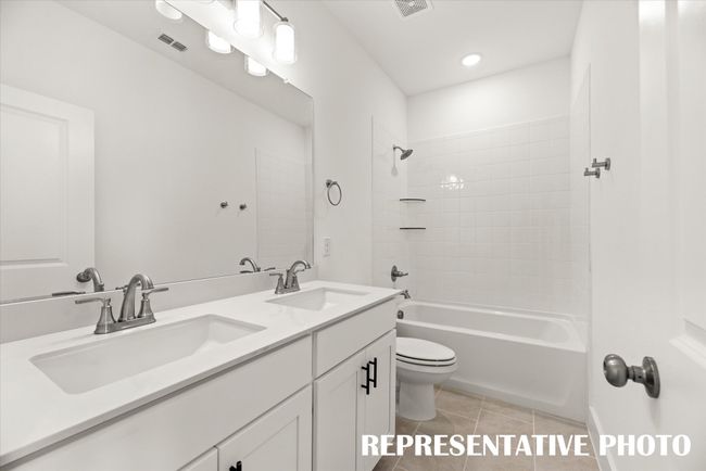 Guests will enjoy their own space in this lovely guest bath! REPRESENTATIVE PHOTO | Image 15