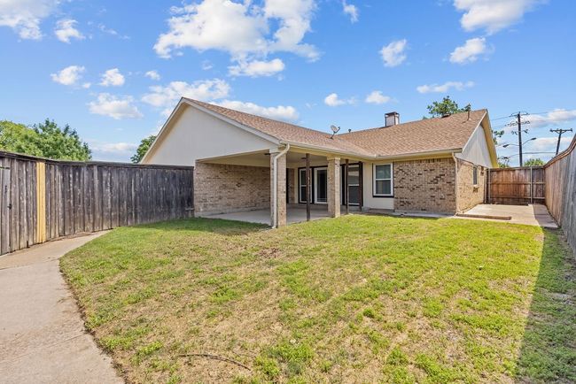 Back of house featuring brick siding, a patio area, and a shingled roof | Image 28