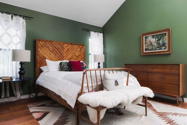 Bedroom with lofted ceiling and wood finished floors | Image 23