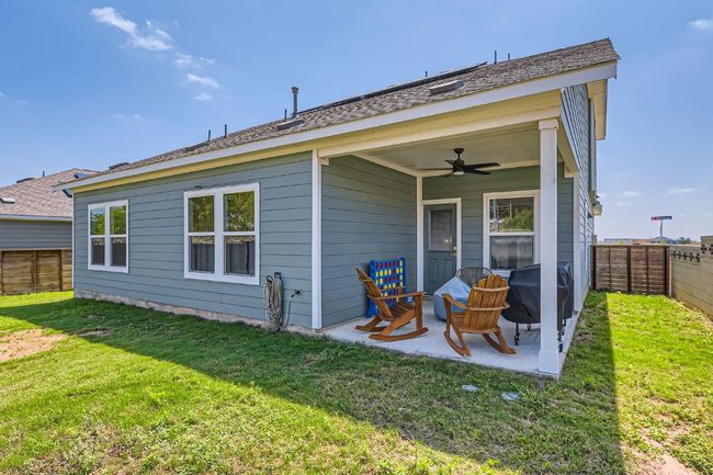 Back of house with a ceiling fan, a fenced backyard, and a patio area | Image 26