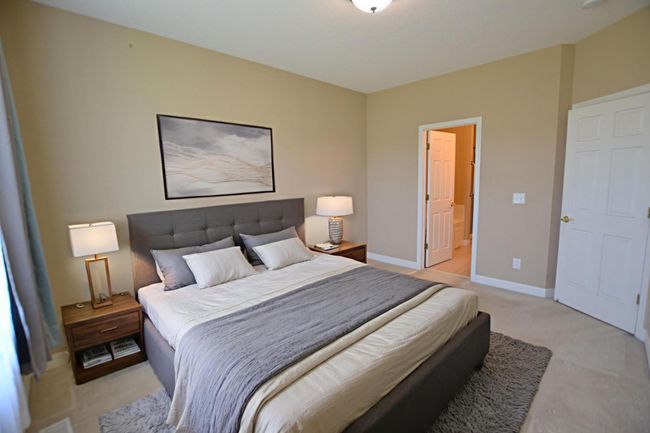 Make this inviting owner’s suite your personal escape. Virtual staging. | Image 5