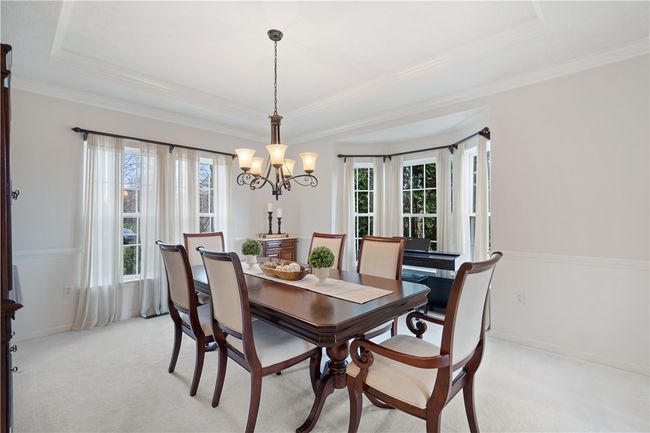 Another bay window and tray ceiling in the formal dining room. | Image 5