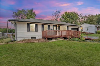 View of front of home with a deck and a yard | Image 2