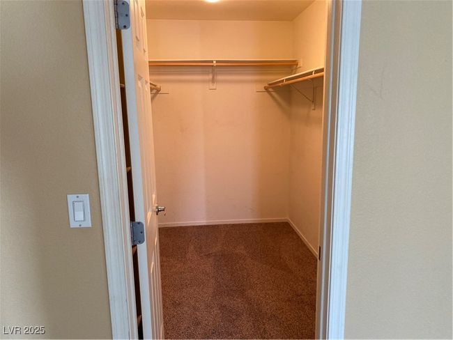 Spacious closet featuring carpet | Image 16