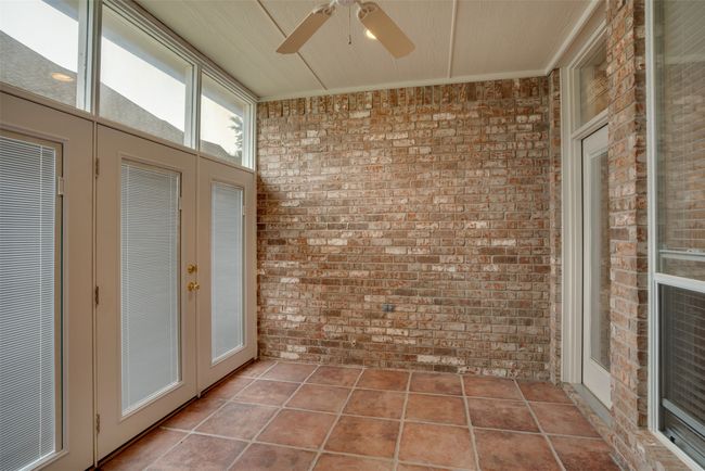 Unfurnished sunroom with a ceiling fan | Image 32