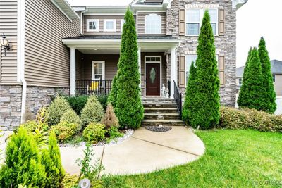 View of exterior entry with a lawn | Image 3