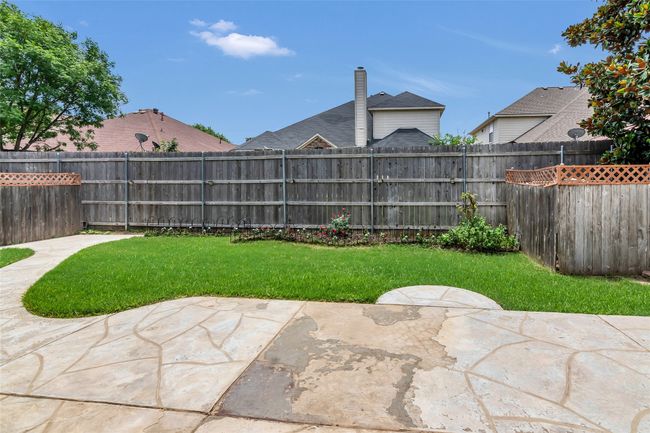 Fenced backyard featuring a patio area | Image 36