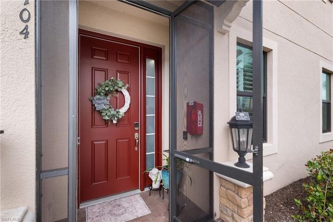 Doorway to property featuring stucco siding | Image 28