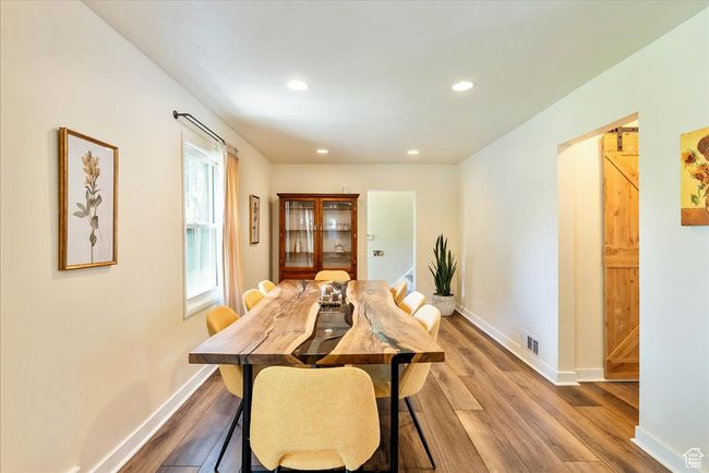 Dining space featuring wood finished floors and recessed lighting | Image 23