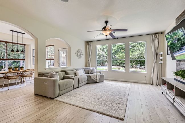 Generous living space with backyard views and room to relax. | Image 6