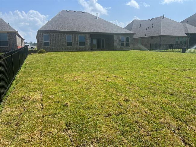 Huge backyard with covered patio | Image 10