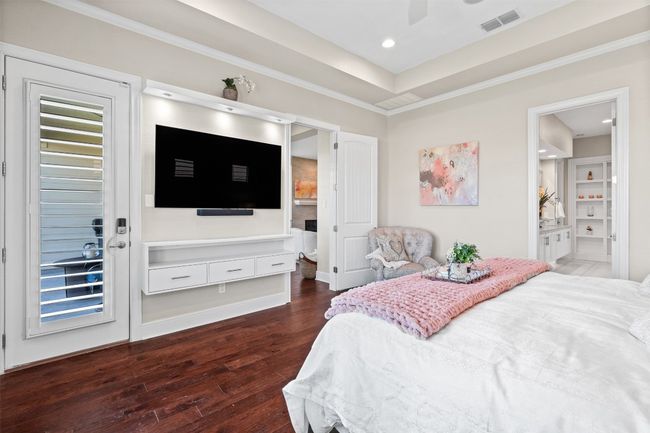 Custom woodwork adds character, while direct patio access brings in natural light and offers a peaceful escape. | Image 16