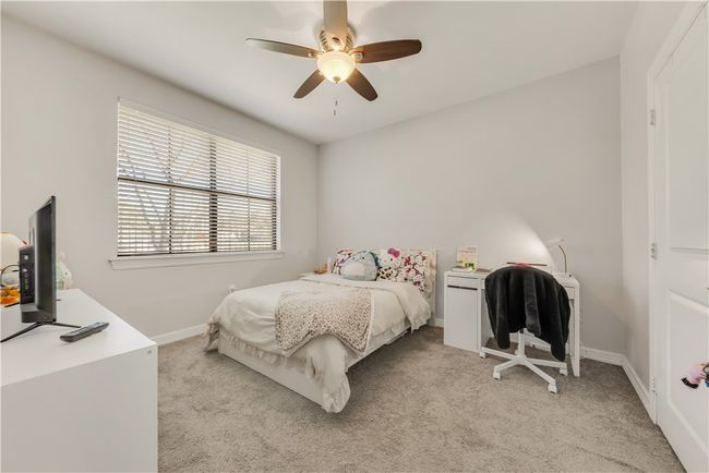 Carpeted bedroom with ceiling fan | Image 16