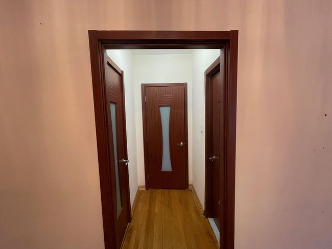 Corridor with light wood-style flooring and baseboards | Image 10
