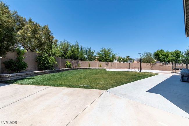 View of yard featuring a patio and a fenced backyard | Image 43