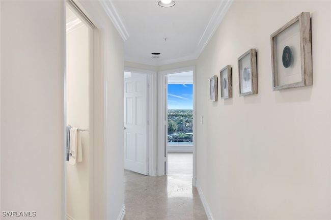 Third Bathroom on the Left. Hallway to the Guest Bedroom Suite on the right, and Guest Bedroom to the left. Both Guest Bedrooms access the east facing Lanai, Sunrise views and City Lights at night. | Image 20