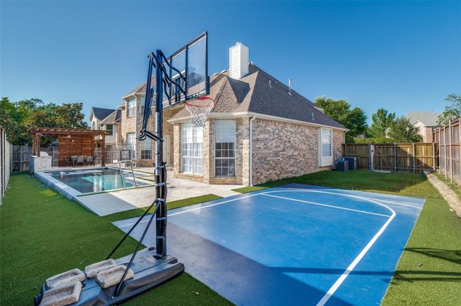 View of sport court with a pergola and basketball court | Image 33