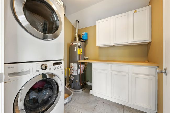 Laundry room with cabinetry and extra storage space. | Image 26